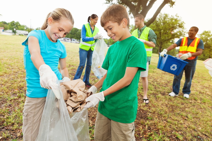 Teaching children to recycle in a park